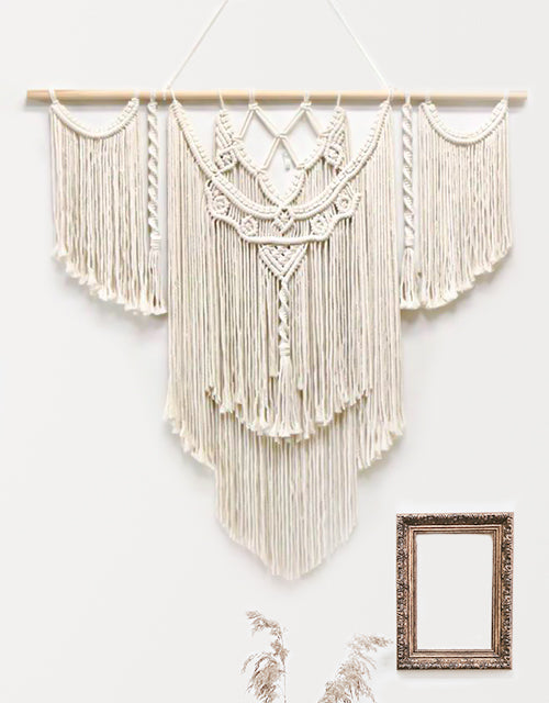 grande tenture murale macramé avec un cadre doré